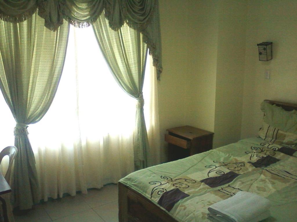 באגויו Oyo 765 Ibay Zion Hotel חדר תמונה